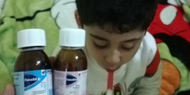 Toddler taking Panadol - طفل يأخذ دواء بانادول
